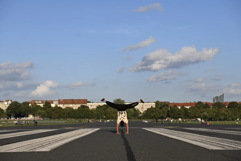 Handstand wearing GATI natural-fiber clothing for unrestricted movement